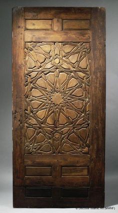 an old wooden door with intricate carvings on it