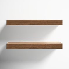 two wooden shelves against a white wall