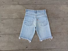 Retro Cutoff Light Wash Jeans, Retro Light Wash Cutoff Jeans, Retro Cutoff Jeans With Frayed Hem, Vintage Cutoff Faded Shorts, Vintage Cutoff Jeans With Frayed Hem, Retro Cutoff Jean Shorts With Frayed Hem, Vintage Faded Cutoff Shorts, Faded Vintage Jean Shorts, Short Levis