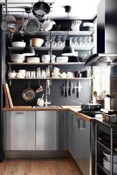 a kitchen filled with lots of pots and pans