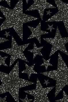 an abstract black and white background with stars in the middle, which are scattered on top of each other