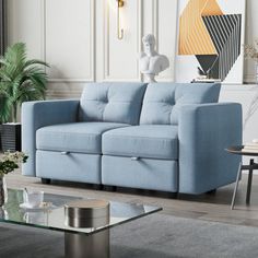 a living room with a blue couch and coffee table