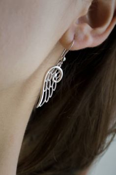 Angel Beautiful Wing Earrings, for everyday wear. Feel the magic in your ears. Elegant and chic, for woman and teens. For special lovely gift Modern earrings. ✨DIMENSIONS & VARIATIONS✨ The total length of the earring (including the hook) is 43mm. We have it also as stud earrings (5mmx14mm) on the following link: https://www.etsy.com/listing/526801090/ ✨MATCHING JEWELS✨ Bracelet https://www.etsy.com/listing/526478810/ Pendant https://www.etsy.com/listing/540289431/ ✨WHAT INCLUDES?✨ ● Card Wit Whimsical Sterling Silver Jewelry For Party, Whimsical Silver Single Earring Jewelry, Silver Fairy Earrings For Party, Fairy Style Jewelry With Matching Earrings Gift, Winged Sterling Silver Earrings For Gift, Winged Sterling Silver Earrings As Gift, Sterling Silver Winged Earrings Gift, Fairy Style Drop Earrings For Gifts, Elegant Winged Earrings For Gift