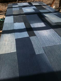 an outdoor table covered in blue and black squares