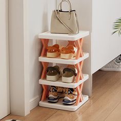 three tiered shoe rack with shoes on it