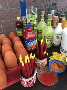 the table is full of condiments, sauces, and other items to make an appetizer