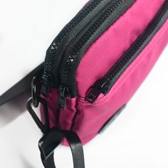 A magenta rose pink with a silver gray liner, Versatile, fun and cute this lightweight bag features 3 functions in 1. Wear it as a hip pack, crossbody bag or wristlet. Stay hands free and carefree with plenty of room for your wallet, keys, phone and other small everyday necessities. Our strap system is intended to create versatility of use and fit a variety of body types. Includes:-4 zippered compartments -52” strap that fits waist/hip size 39”-61.5” or extend fully for crossbody wear -31” strap Pink Phone Bag With Removable Pouch For Travel, Pink Mobile Phone Bag For Travel, Pink Crossbody Phone Bag For Travel, Pink Versatile Phone Bag For Travel, Pink Pouch Bag With Cell Phone Pocket, Functional Pink Mobile Phone Bag, Versatile Pink Phone Bag For Travel, Pink Shoulder Phone Bag For Everyday Use, Pink Bag With Zipper Pouch For Everyday Use