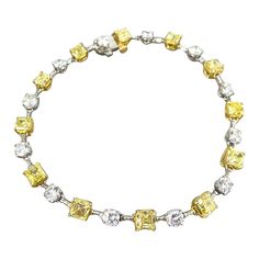 This exceptional yellow and white diamond bracelet by J. Birnbach is a sophisticated and unique way to add yellow diamonds to your jewelry wardrobe! Featuring 6.18 carats of fancy intense yellow asscher cuts that alternate with 2.39 carats of white round diamonds, this is an amazing mix of color and sparkle. The bracelet is crafted in platinum, and the yellow asscher cut diamonds are set in 18K yellow gold. This piece is stunning worn by itself or layered with your favorite tennis bracelet. Formal Octagon Diamond Bracelet, Formal Yellow Diamond Bracelet, Luxury Diamond Bracelet With Asscher Cut, Elegant Yellow Diamond Bracelet For Formal Occasions, Elegant Yellow Jewelry With Single Cut Diamonds, Luxury Yellow Bracelets For Anniversary, Classic Yellow Jewelry With Single Cut Diamonds, Yellow Diamond Baguette Cut Jewelry, Fine Jewelry With Single Cut Yellow Diamonds