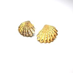 Vintage seashell earrings, gold toned finished.post back earrings. Sea shell jewelry, nautical.  Scallop shell earrings.Beach seaside jewelry, summertime bling.    Size of earrings:1" x .75" or 2.5 x 1.8 cm approxinatelyCondition:Fair.  A fair amount of wear on the front.  The finish is worn away a bit and tarnish on the underside. See photos above.  There are no back to the posts.  Would be lovely worn or re-purposed!You might like:http://www.etsy.com/listing/103610925/strawberry-purse-basket-c Nickel Free Ocean-inspired Gold Earrings, Nickel Free Gold Ocean-inspired Earrings, Gold Brass Shell-shaped Earrings, Gold Shell-shaped Brass Earrings, Gold Shell Earrings For Summer, Gold Shell With Matching Earrings, Shell-shaped Gold Shell Earrings, Gold Shell-shaped Shell Earrings, Gold Brass Shell Earrings