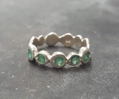 Emerald Band set with Natural Emerald in a top grade, diamond cut & natural green color, at 3mm diameter, 1Ct combined, sourced from Burma. Stackable Band made of Solid 925 Sterling Silver ☞ made to last. Add more pieces to stack your ring: 1. www.etsy.com/uk/listing/701490415 2. www.etsy.com/uk/listing/694011217 3. www.etsy.com/uk/listing/496837324 4. www.etsy.com/uk/listing/701487311 ☞ Choose your size ☞ I resize (before shipping) for FREE to Any size* Matching Earrings & Matching Pendant - pl Hippie Ring, Emerald Band, Earrings Matching, May Birthstone Rings, Natural Emerald Rings, Hippie Rings, Emerald Ring Gold, Stackable Bands, Real Jewelry