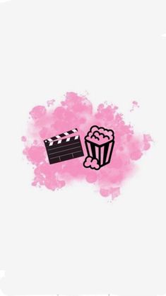 a movie clapper and popcorn in front of a pink spot with watercolor stains