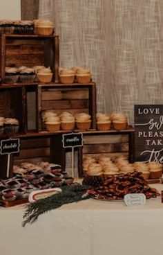 a table topped with lots of pastries and desserts