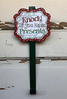 a sign that says know if you have presents on the front of a door or window