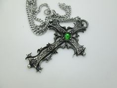 This Gothic cross necklace is an handmade pewter sculpture orned with an Austrian Swarovski or a real gem (My fav is the Black star Diopside, seriously) This gothic necklace is sold with a stainless steel chain of 18'' or 24'', if you would like to have a different length for the chain, you can write the desired length in the private note section when ordering :) This is a Gothic cross of 7cm This gothic cross necklace is a pewter sculpture of my own creation, i create and work the metal by myse Gothic Green, Gothic Cross Necklace, Cross Gothic, Gothic Cross, Gothic Crosses, Dragon Bracelet, Punk Accessories, Gothic Necklace, Cuff Jewelry