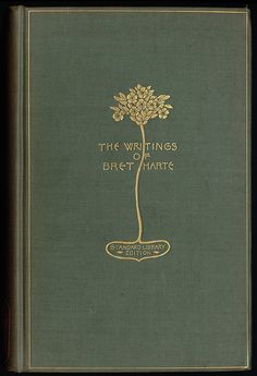 an old book with gold lettering and a tree on the front cover that says,'the writings of bret harte