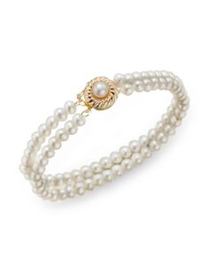 This elegant double-stranded bracelet features cultured freshwater pearls with a 14K yellow gold clasp. Classic Double Strand Bracelet As Gift, Elegant Double Strand Jubilee Bracelet, Elegant Multi-strand Jewelry For Anniversary, Elegant Rondelle Gold Bracelet For Formal Occasions, Classic Double Strand Bracelet Gift, Elegant Double Strand Pearl Drop Jewelry, Classic Multi-strand Jewelry For Formal Occasions, Elegant Single Strand Gold Bracelet With Round Beads, Elegant Pearl Bracelets With Sterling Silver Clasp