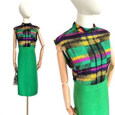 Beautiful dress with a turn-up collar, originally from the 70s. The bottom part is plain green, the top part is made of silky viscose with a colorful pattern. A very high-quality dress, which you can see straight away. There is a long zipper with two hooks at the back. If you need a smaller size, the dress can be made smaller by a tailor. The zipper is in the middle of the back. Very good vintage condition! Estimated size: 40/L - Please be sure to check the measurements! Dimensions - measured flat: Length 108 cm / 42.5 inches Chest 51 cm / 20" inches Waist 44.5 cm / 17.5 inches Label: GERBER Exclusive - Hamburg/Germany Color: Green/Colorful Material: viscose, cotton Check out my shop for more vintage products: https://www.etsy.com/de/shop/TheDustyDecades?ref=seller-platform-mcnav Colors ma Fitted Green Midi Dress For Workwear, Green Midi Dress For Office, Vintage Green Dress For Work, Retro Green Dress For Work, Vintage Green Midi Length Dress, Green Cotton Midi Dress For Work, Green Belted Midi Dress For Work, Retro Green Midi Dress For Spring, Green Midi Dress For Work