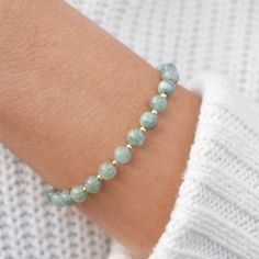 "This hand made bracelet features a most elegant selection of genuine Jade gemstones, perfectly adorned with tiny metal accent beads in between each stone. Every stone is natural, so they may vary oh-so-slightly from one another. This bracelet makes a wonderful gift for any Jade lover in your family or friend circle. Each 6mm jade bead is carefully hand-strung on durable beading wire that is guaranteed and covered for a lifetime. Bracelet Length: 6.5-8\". This adjustable bracelet measures 6.5\" Elegant Crystal Jewelry, Friend Circle, Healing Gemstone Bracelets, Healing Gemstones, Bracelet Elegant, Beads Bracelet Design, Moonstone Bracelet, Wedding Jewelry Bracelets, Natural Stone Bracelets