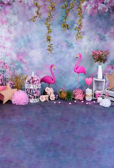 a pink flamingo themed birthday party with birdcage, cake and flowers on the table