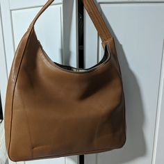 Brand New Unused Caramel Medium Deadstock Leather Bag Luxury Brown Hobo Bag For Everyday, Classic Brown Bucket Bag With Top Handle, Cognac Hobo Shoulder Bag For Shopping, Cognac Hobo Bag For Shopping, Classic Cognac Hobo Bag For Shopping, Luxury Brown Hobo Bag, Luxury Brown Hobo Bag For Shopping, Luxury Caramel Everyday Shoulder Bag, Formal Brown Soft Leather Hobo Bag