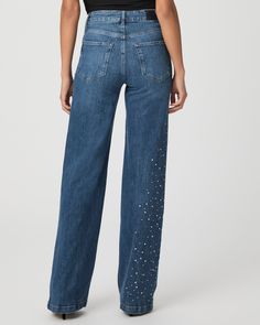 Be a showstopper this season in our crystal-embellished Sasha jeans. This high-rise wide leg is designed with a fitted top block and a slightly relaxed fit in a medium wash with marble texture throughout. This pair is crafted from our PAIGE VINTAGE denim which takes all of the work out of breaking in your favorite pair of vintage jeans. We've combined the comfort of stretch with everything you love about authentic vintage denim to create super soft jeans that feel perfectly lived-in from the ver Embellished Denim Blue Straight Leg Bottoms, Crystal Embellished Denim Jeans, Chic Straight Leg Jeans With Rhinestones, Chic Straight Leg Bottoms With Rhinestones, Chic Embellished Denim Jeans, Elegant Embellished Denim Bottoms, Chic Rhinestone Jeans For Spring, Spring Embellished Flare Denim Jeans, Spring Embellished Flare Jeans