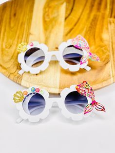 Our Personalized Mermaid Daisy Sunglasses are sure to be a hit with any little one. Each pair, is personalized with white and gold acrylic beads and finished with a laser cut seashell and Mermaid fin. These are perfect for the mermaid lover in your life. Wear them to the beach, summer outing or all year long. Ideal for various summer outdoor activities, such beach, traveling, sun bath, also suitable for birthday parties, boho themed parties, groovy hippie themed parties and so on. Perfect size f Whimsical Sunglasses With Uv Protection For Beach, Whimsical Beach Sunglasses With Uv Protection, Novelty Adjustable Sunglasses For Beach, Whimsical Adjustable Sunglasses With Uv Protection, Handmade Sunglasses For Summer Beach, Daisy Sunglasses, Boho Themed Party, Sun Bath, Beaded Glasses