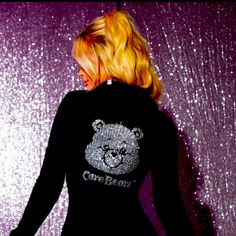 This Beautiful Black Fitting Dress Featuring The Care Bears Logo Big And Glittery Made Of Rhinestones Placed To Cover The Whole Back Is A Must-Have For Any Fan Of The Beloved Care Bears Characters And Their Soft Hugs! The Dress Is Designed With Long Sleeves And Fur Cuffs For A Comfortable And Stylish Look. It Also Has A Fur Collar And One Button Closure, Adding To Its Unique And Comfy Night Out Look. The Dress Comes In All Sizes S,M,L,Xl And Is Perfect For Casual Occasions Or A Night Out In Town Black Fitting Dress, Care Bears Logo, Care Bears Characters, Care Bear Dress, The Care Bears, Bears Logo, Fur Cuffs, Bear Logo, Fitting Dress