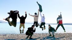 a group of people jumping in the air