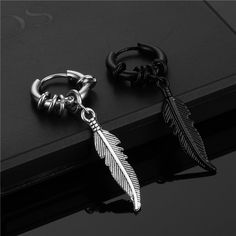 Material: Titanium Steel Color: Black (Single), Steel (Single) Fashion Element: Feather Style: Personality Black Minimalist Metal Cartilage Earrings, Adjustable Black Metal Cartilage Earrings, Trendy Black Metal Cartilage Earrings, Black Metal Cartilage Earrings, Black Punk Dangle Hoop Earrings, Black Dangle Hoop Earrings Punk Style, Black Dangle Hoop Earrings In Punk Style, Black Metal Dangle Cartilage Earrings, Black Dangle Cartilage Earrings