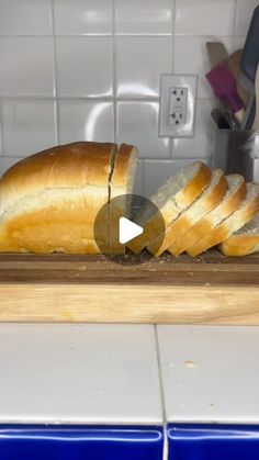 a loaf of bread sitting on top of a cutting board