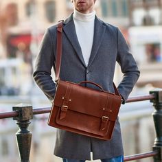 The leather briefcase bag from Wilderoe is not only a stylish accessory, but also a convenience for everyday life. This tan leather briefcase is designed to bring more comfort to your daily life. Spacious on the inside and minimalist on the outside. What could be more relevant and useful in a busy city life? For men and women, these messenger bag are not just a leather accessory, but a way to emphasize your individual style. Lightweight and elegant, each crossbody bag is the perfect complement to your look, holding your important items with ease. You can put your documents, books, laptop in it. Use it for work, meeting with friends or just to stand out in the crowd. Your urban style will be harmonious.  ❇️COMPARTMENTS: Front: There is one large convex pocket of 32*19 cm with metallic snaps Business Cognac Satchel Shoulder Bag, Cognac Satchel For Business Trips, Smooth Grain Shoulder Bag Briefcase For Travel, Smooth Grain Shoulder Briefcase For Travel, Cognac Satchel Briefcase With Luggage Sleeve, Leather Satchel Backpack For Business Trips, Brown Business Briefcase Shoulder Bag, Brown Shoulder Bag Briefcase For Business, Modern Brown Briefcase With Adjustable Strap