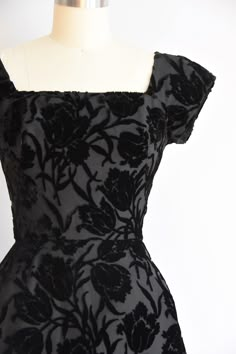 "Stunning vintage 1950s cocktail dress. Flock velvet in floral motif. Square collar and v back. Capped sleeves, darted bust and nipped waist. Semi full skirt with crinoline underneath. Back metal zip closure. State of garment | very good, light overall wear with one small discoloration mark on back of skirt. request additional photos if needed. Measurements ✂--- Best fit | Small Bust | 34\" Shoulders | not specified Shoulder to waist | shy of 15\" Sleeves | 5\" Waist | 25\" Hips | up to 38\" Tot Velvet Flower Dress, 1950s Satin Dress, Vintage Velvet Dress With Fitted Bodice, Vintage Square Neck Evening Dress, Vintage Velvet Cocktail Dress, Cocktail Dress Floral, Vintage Cocktail Dresses, 1950 Dress, 1950s Cocktail Dress