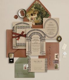 the wedding stationery is laid out on top of each other