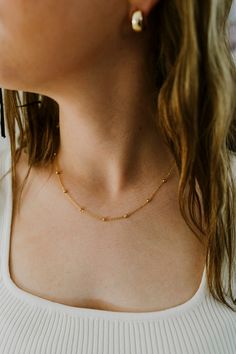 Our Dainty Gold Ball Chain Necklace is the perfect layering piece for your jewelry collection! Made with 24K Gold Filled metal, this necklace will not tarnish and is water prooff. Length: 18 InchesWidth : 1.3MM, BEAD-3.0MMIt has a spring clasp closure. Gold-plated Satellite Chain Necklace, Gold Satellite Chain Necklace For Everyday, Gold Choker Necklace With Satellite Chain, Everyday Gold Satellite Chain Necklace, Dainty Gold Hypoallergenic Chain Necklace, Everyday Gold Necklace With Satellite Chain, Hypoallergenic Link Necklace For Gift, Gold Satellite Chain Choker Necklace, Satellite Chain Charm Choker Necklace