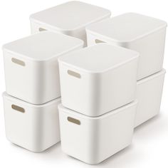 four white storage containers stacked on top of each other