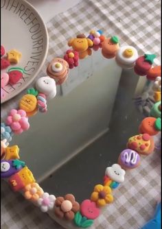 a close up of a mirror on a table with buttons and other things around it