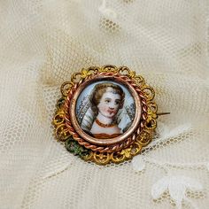 "Antique French brooch, gold color filigree, hand painted miniature on porcelain of a lady in Elizabethan costume, brooch with miniature. DESCRIPTION: Very lovley antique French brooch with a hand painted miniature on porcelain featuring a lady in Elizabethan costume, framed in gilt metal filigree, dating to early 1900's. HOW TO USE IT: A beautiful antique brooch with delightful miniature of lady, perfect gift for Valentine's Day! CONDITIONS: Good antique conditions, there are light oxydation tr Yellow Gold Enamel Brooches, Gold Formal Enamel Pin, Victorian Style Enamel Pin Gift, Victorian Brooches For Ceremonial Occasions, Wedding Enamel Pin Brooch, Gold Enamel Wedding Brooch, Gold Enamel Wedding Brooches, Antique Style Pins As Gifts, Victorian Gold Enamel Pin