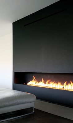 a modern fireplace in the middle of a room