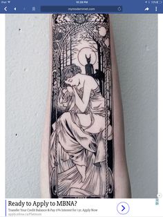 a black and white tattoo on the arm of a woman with an image of a cat