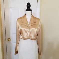 Honey Gold Yellow Satin Button Down Long Sleeve Blouse By Dressbarn In Nwot Condition. Size 14/16w Annequin Is Size S. See The Pictures. Elegant Dressy Or Casual Blouse With Double Layered V Neck Collar. Approximate Measurements Flat Long From Neck To Hem 28" Chest - 23" Wide At Hem - 24" Sleeve - 24" Sleeve Opening - 4" In Nwot Condition - No Signs Of Wear. Classic Gold Blouse For Workwear, Gold Formal Blouse With Button Closure, Gold Blouse With Button Closure For Formal Occasions, Chic Semi-formal Blouse With Buttons, Spring Evening Blouse With Button Closure, Gold Button-up Blouse For Work, Elegant Gold Collared Top, Gold Collared Blouse For Formal Occasions, Fitted Gold Blouse For Office