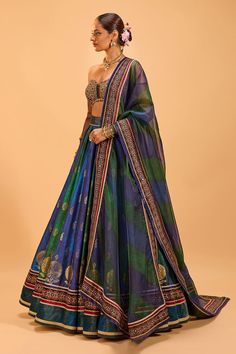 Green and blue attached cancan panelled lehenga with foil block print and embroidery details. Paired with a padded sequin embroidered tasseled blouse and embroidered border dupatta. - Aza Fashions Panelled Lehenga, Cape Lehenga, Kurta Lehenga, Lehenga Pattern, Lehenga Skirt, Tarun Tahiliani, Embroidered Border, Bridal Lehenga, Modern Bride