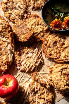 an apple and some cookies on a table