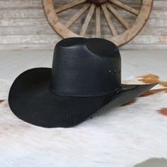 Step into the Western spirit with the Twister Casual Hat by M & F Western Products. This ruggedly durable hat showcases a sleek black design complemented by a 2-cord black band. Designed for both style and functionality, it features eyelets for added breathability, ensuring comfort throughout the day. Brim: 4" Crown: 4-1/4" Color - Black Straw Material - 100% Paper Western Hat, Western Hats, M F, Casual Hat, Black Design, Western Fashion, Straw, The Day, Sleek