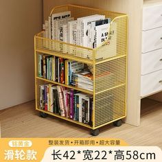 a book shelf with books and magazines on it in front of a white dresser next to a wall