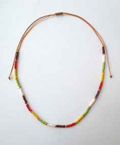 "Beaded Choker, Dainty Choker, Seed Bead Choker, Trendy Jewelry, Bohemian Jewelry, Beach, Summer, Short necklace Girlfriend gift Gift for her Seed bead necklace with seed beads in brown,orange,lime,yellow,gold,ivory and brown waxed string! Light weight around the neck and very comfortable to wear. Choker measures 11.2\"/28.5cm and has a 8.6\"/22cm ending strings that can open up to 28.4\"/72cm. If you need any additional length please convo." Rat Jewellery, Necklace Girlfriend, Seed Bead Choker, Goth Choker, Red String Bracelet, Dainty Choker, Lucky Bracelet, Bead Choker, Jewelry Beach