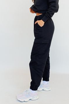 Introducing our exclusive limited-edition women's oversized cargo sweatpants. Crafted from high-quality materials, these sets redefine comfort and style. Available in sizes XS to 2X, find your perfect fit with regular or tall lengths for the bottoms. Embrace the freedom of movement and comfy chic with our meticulously designed, oversized fits. Elevate your loungewear game. Shop now before they're gone. -High rise -Heavyweight fleece fabric -Oversized silhouette -Elastic waistband -Interior draws Sporty Cargo Pants With Ribbed Cuffs For Streetwear, Cotton Cargo Pants With Multiple Pockets For Loungewear, Urban Style Cargo Pants For Jogging, Cotton Sweatpants With Multiple Pockets For Loungewear, Sweats With Pockets For Streetwear In Fall, Urban Sweats With Elastic Waistband For Streetwear, Urban Style Sweats For Streetwear With Elastic Waistband, Black Sweats With Pockets For Loungewear, Oversized Sweats With Elastic Waistband For Streetwear