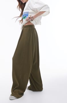 Go for chic volume in these roomy pants cut from gorgeous plissé fabric for textural intrigue. 28" inseam; 20" leg opening; 16" front rise; 19" back rise (size Medium) Elastic waist 100% polyester Machine wash, line dry Made in Turkey Solid Color Wide Leg Parachute Pants For Spring, Full Length Harem Pants With Elastic Waistband, Solid Color Ankle-length Parachute Pants With Elastic Waistband, Spring Baggy Pleated Pants, Casual Solid Pleated Pants, Casual Pleated High-waisted Pants, Spring Pleated Baggy Pants, Pleated Ankle-length Pants, Solid Pleated Ankle-length Pants