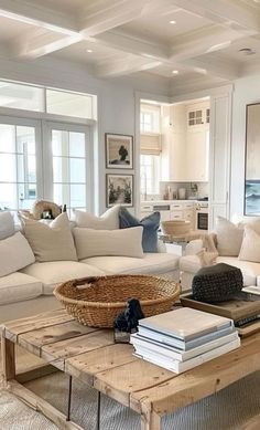 a living room filled with lots of furniture and pillows on top of a wooden table