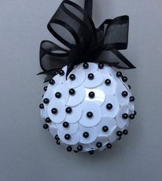 a white ornament decorated with black and white buttons