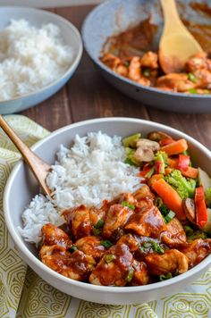 a bowl filled with rice, meat and vegetables